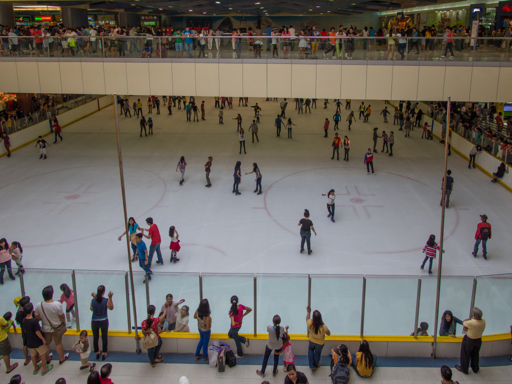 Skating rink in the mall. Can you find the skating cowboy?